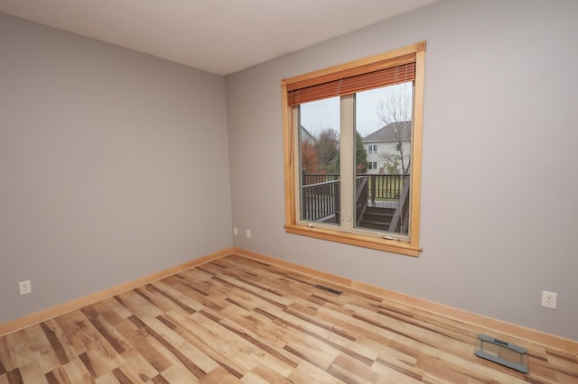 unfurnished room featuring light hardwood / wood-style floors