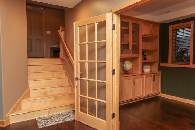 stairs with wood-type flooring