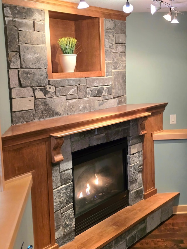 details with a fireplace and hardwood / wood-style floors