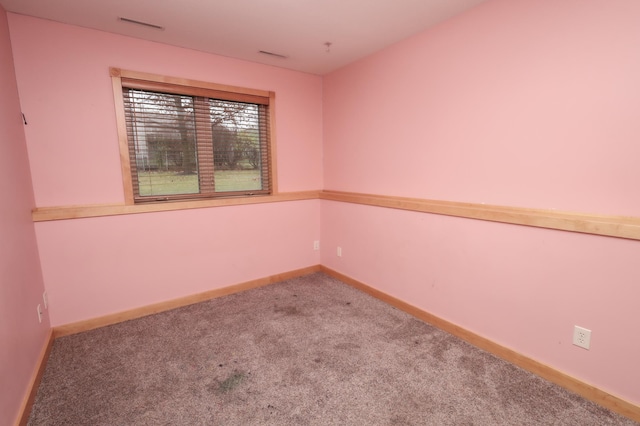 unfurnished room with carpet floors