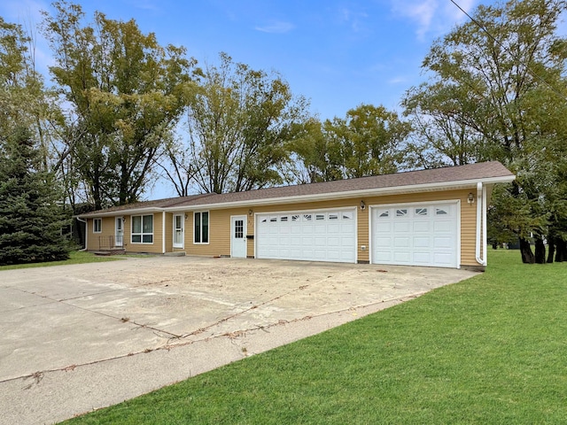 single story home featuring a garage and a front yard