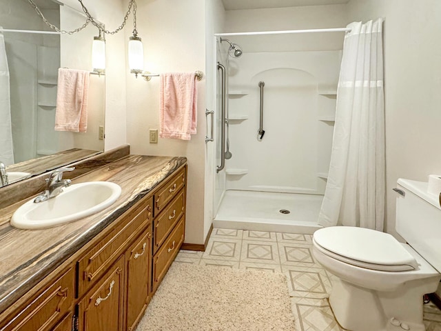 bathroom with toilet, vanity, and a shower with shower curtain