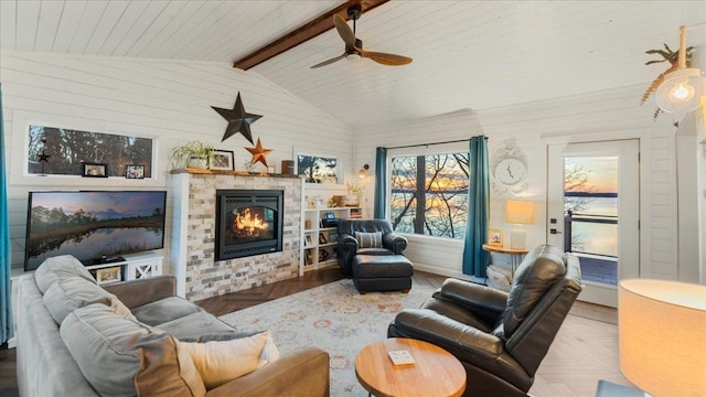 living room featuring ceiling fan, parquet floors, and lofted ceiling with beams