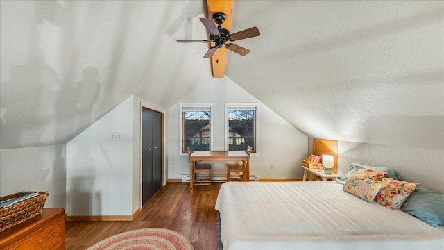 bedroom with a textured ceiling, lofted ceiling with beams, ceiling fan, and dark wood-type flooring