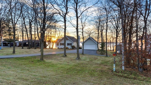 ranch-style home with a yard