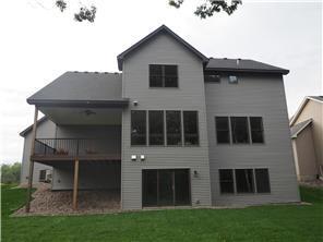 rear view of house with a lawn