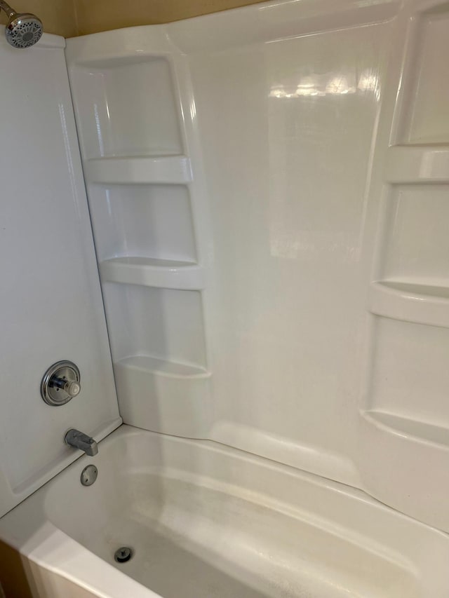 bathroom with shower / bathing tub combination