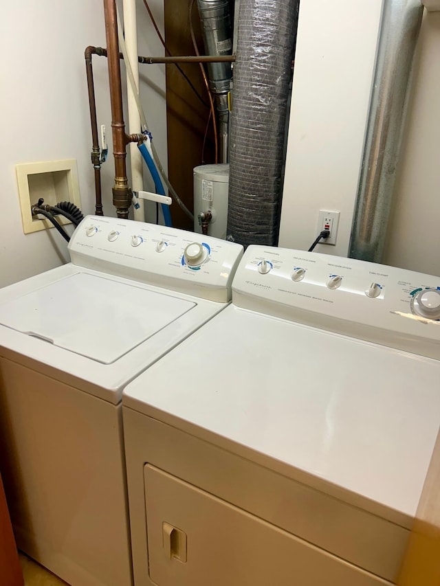 clothes washing area featuring washing machine and dryer