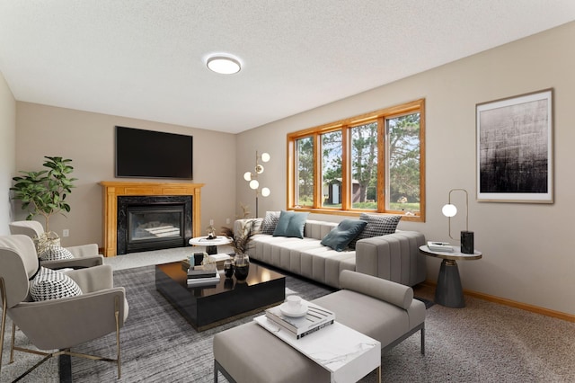 living room featuring a textured ceiling, a fireplace, and carpet