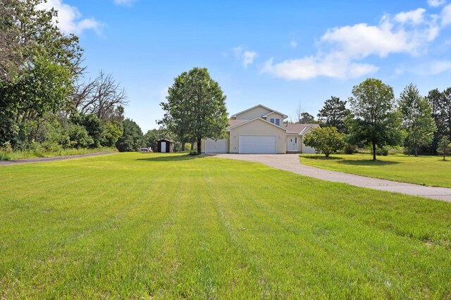 view of front facade featuring a front yard and a garage