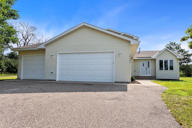 ranch-style home featuring a garage