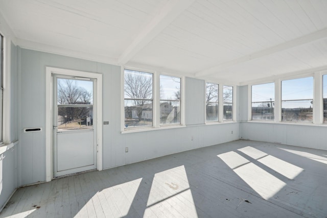 unfurnished sunroom with beam ceiling