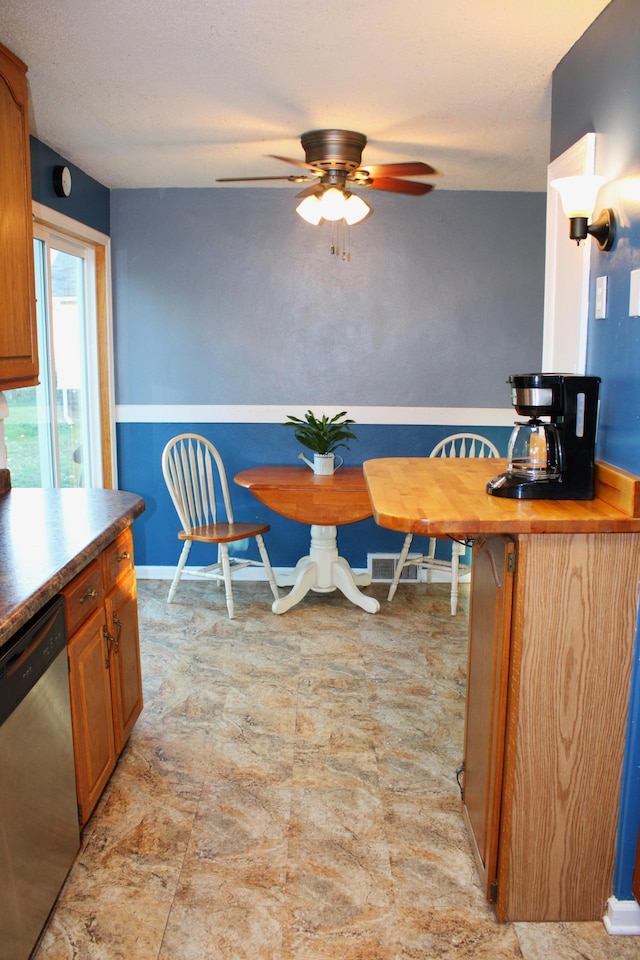 dining space featuring ceiling fan