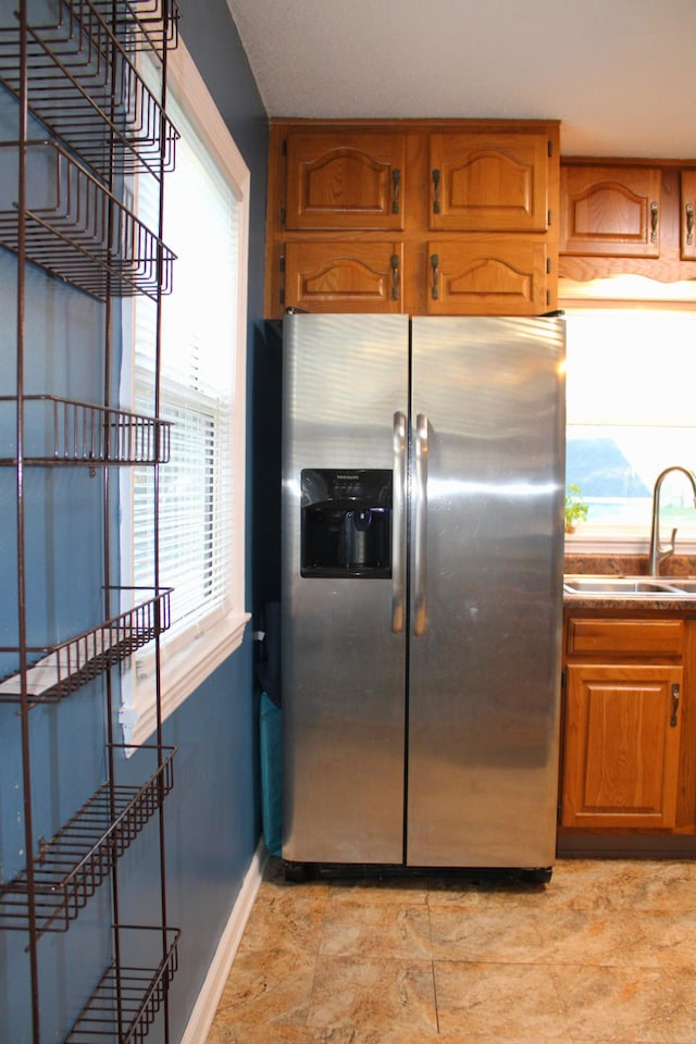 kitchen with sink and stainless steel fridge