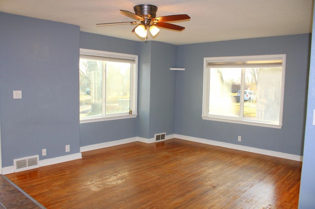 unfurnished room with hardwood / wood-style flooring and ceiling fan