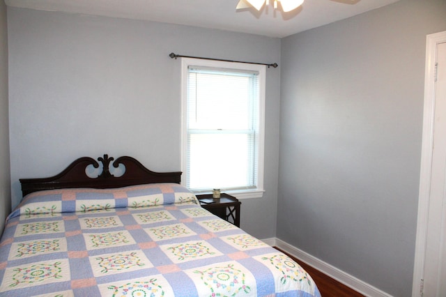 bedroom with wood-type flooring and ceiling fan