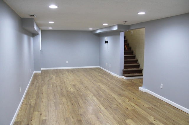 basement featuring light hardwood / wood-style flooring