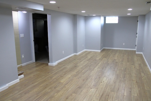 empty room with light hardwood / wood-style floors