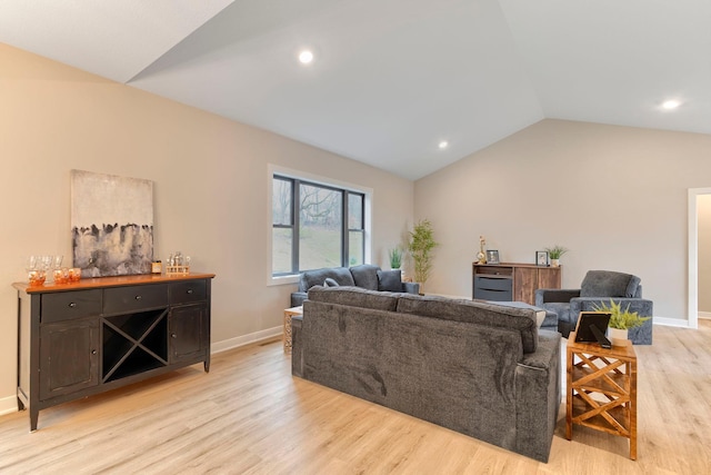 living area with recessed lighting, baseboards, lofted ceiling, and light wood-style floors