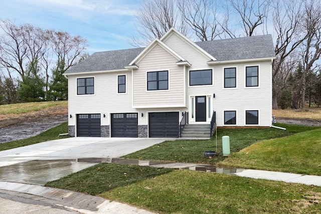 split foyer home with a front lawn, driveway, stone siding, roof with shingles, and a garage