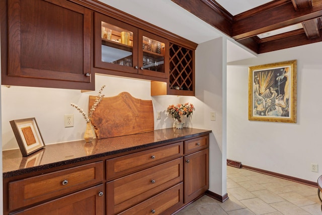 bar featuring beam ceiling, visible vents, baseboards, and light tile patterned floors