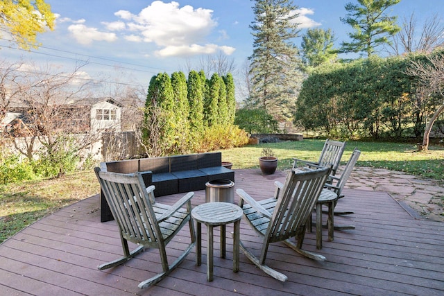 wooden deck with an outdoor living space with a fire pit and fence