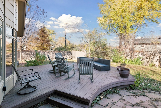 wooden deck with fence and an outdoor fire pit