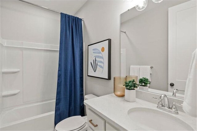 full bathroom with shower / bath combo, vanity, and toilet