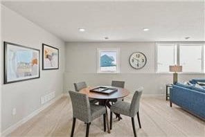 dining area featuring light wood-type flooring