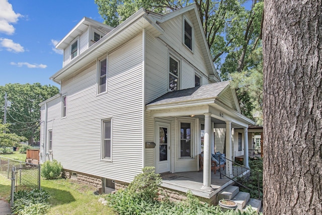 view of property exterior featuring a porch