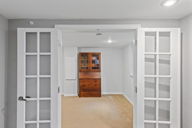 spacious closet with light colored carpet