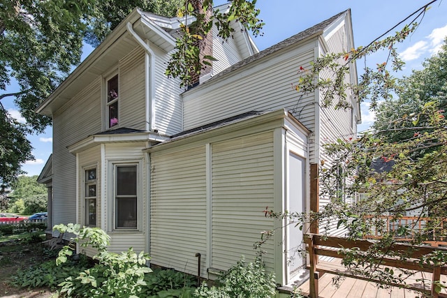 view of side of home with a deck