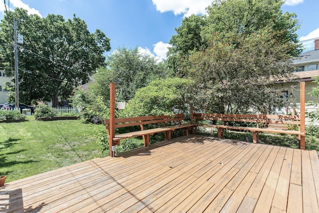 wooden deck with a lawn