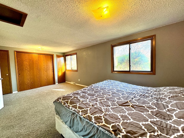 carpeted bedroom with a textured ceiling