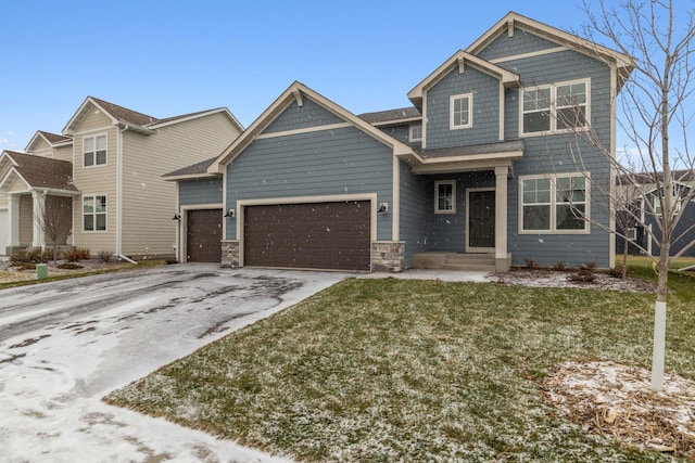 craftsman-style house with a garage and a front yard