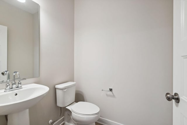 bathroom with toilet and sink