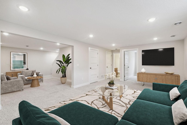 living room with light carpet, baseboards, and recessed lighting