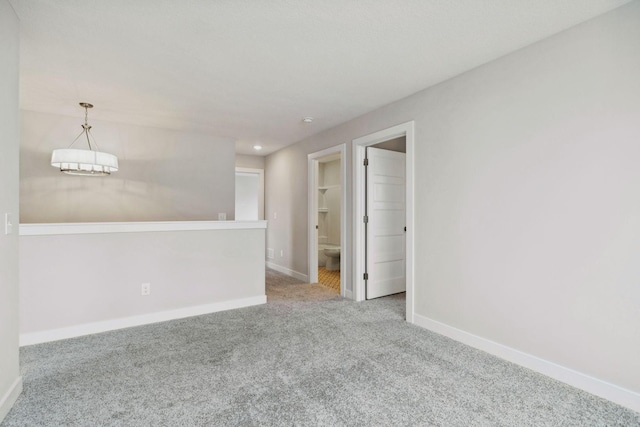 carpeted spare room with baseboards and recessed lighting