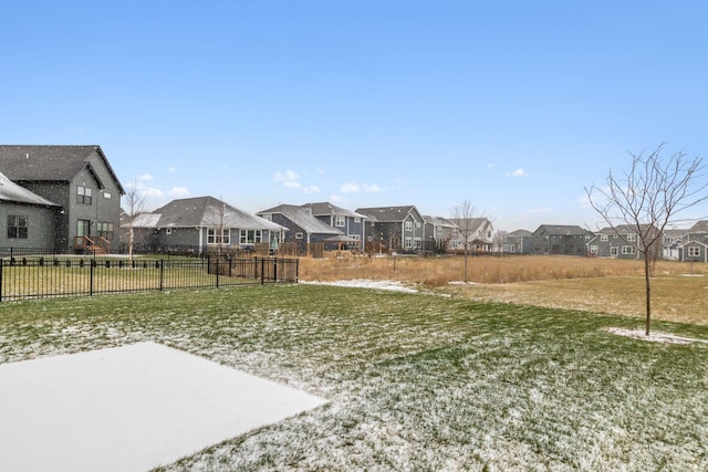 view of yard with fence and a residential view