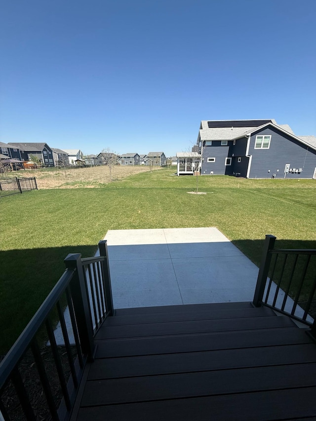 10191 Arrowwood Path, Woodbury, MN 55129 - wooden deck featuring a lawn, a patio area, and a residential view