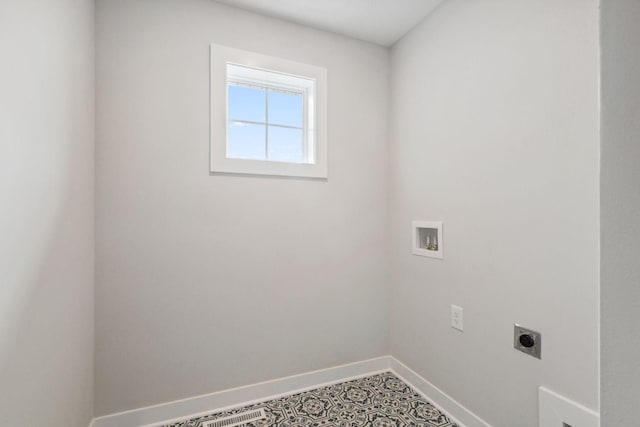 10191 Arrowwood Path, Woodbury, MN 55129 - laundry room featuring hookup for an electric dryer, baseboards, and washer hookup