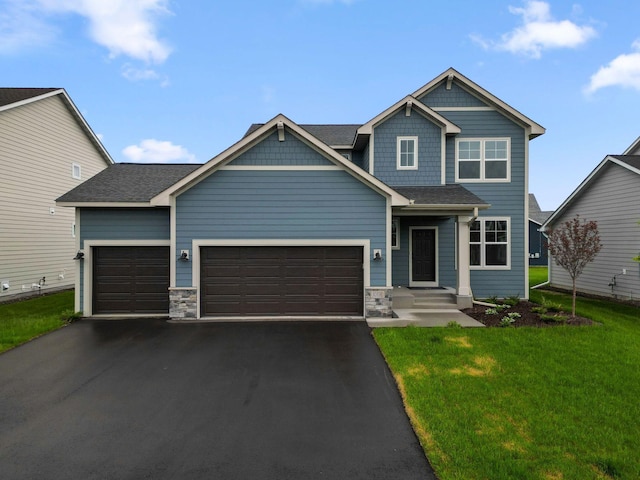 10191 Arrowwood Path, Woodbury, MN 55129 - craftsman inspired home featuring a garage, asphalt driveway, a front lawn, and stone siding