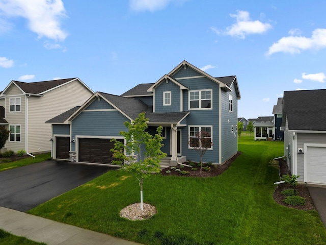 10191 Arrowwood Path, Woodbury, MN 55129 - view of front of property with asphalt driveway, a garage, a front yard, and a shingled roof