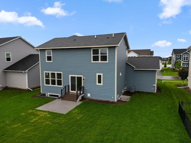 10191 Arrowwood Path, Woodbury, MN 55129 - back of house with a patio, a lawn, and roof with shingles