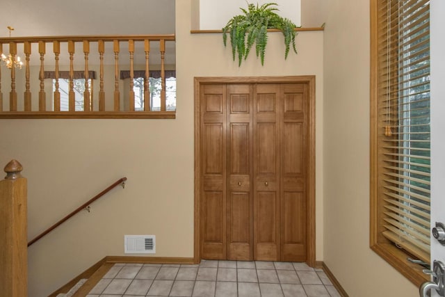 foyer entrance featuring light tile patterned floors