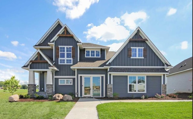 craftsman-style home with a front lawn