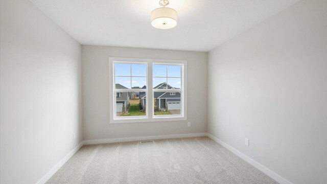 view of carpeted spare room