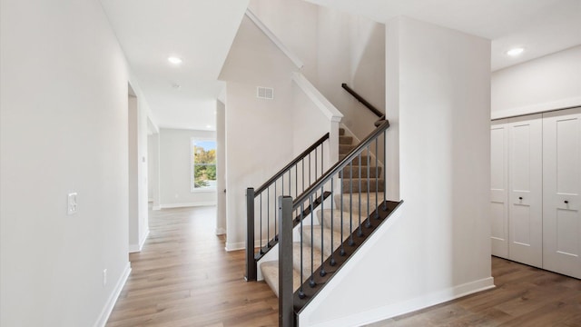 stairs with wood-type flooring