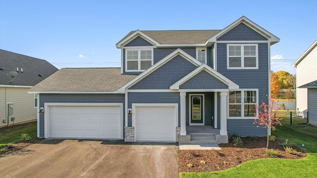 10238 Arrowwood Path, Woodbury, MN 55129 - craftsman-style home with driveway, fence, a shingled roof, and a garage