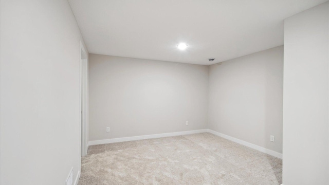10238 Arrowwood Path, Woodbury, MN 55129 - spare room with carpet flooring, baseboards, and recessed lighting